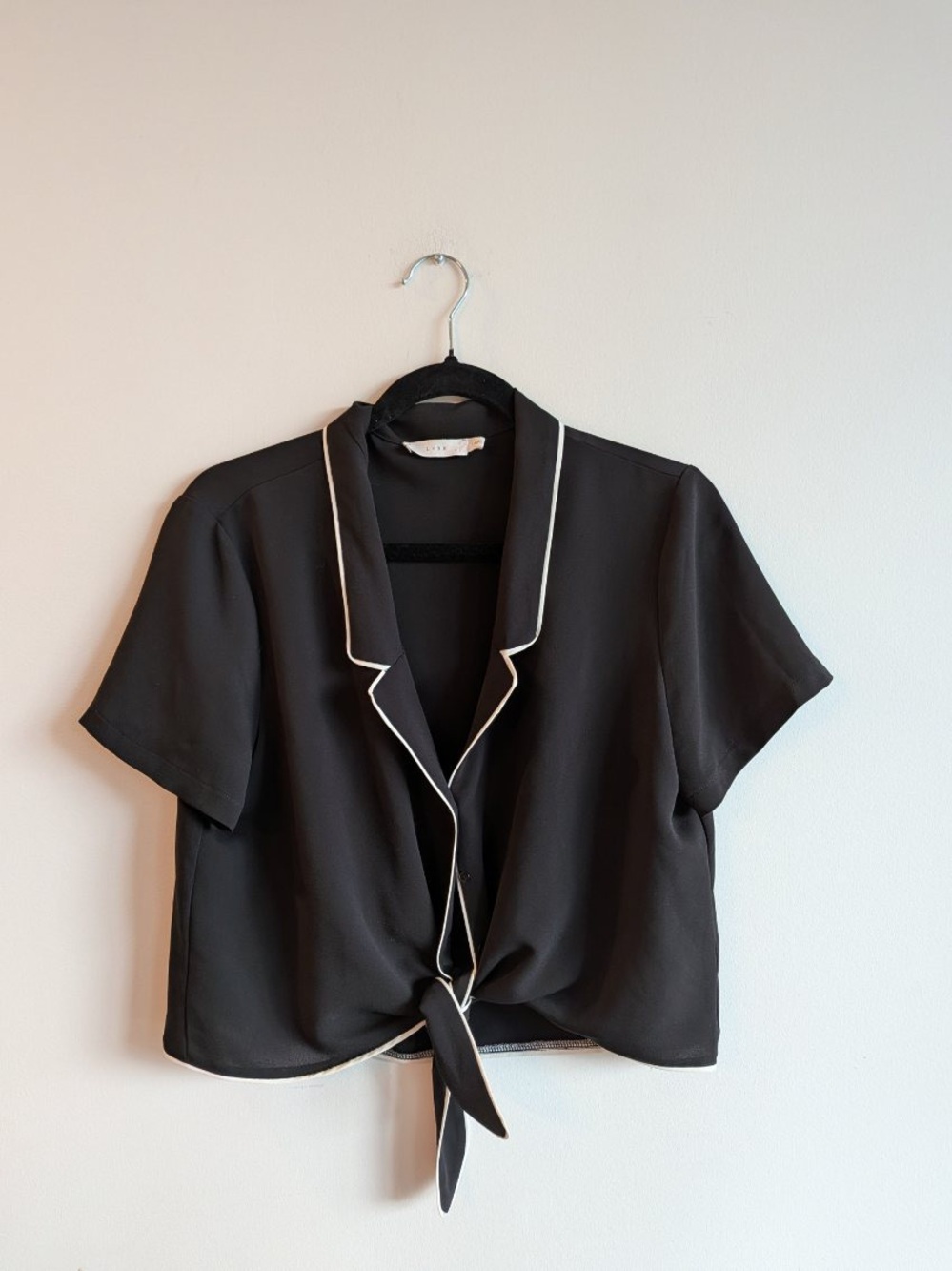 Lush Black Tie-Front Crop Blouse with White Piping